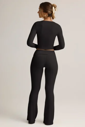 Pantaloni a zampa con risvolto in TENCEL™ Modal a coste, colore nero