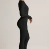 Pantaloni a zampa con risvolto in TENCEL™ Modal a coste, colore nero Pantaloni a zampa con risvolto in TENCEL™ Modal a coste, colore nero