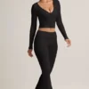Pantaloni a zampa con risvolto in TENCEL™ Modal a coste, colore nero Pantaloni a zampa con risvolto in TENCEL™ Modal a coste, colore nero