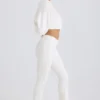 Pantaloni a zampa in jersey di cotone testurizzato, colore bianco Pantaloni a zampa in jersey di cotone testurizzato, colore bianco