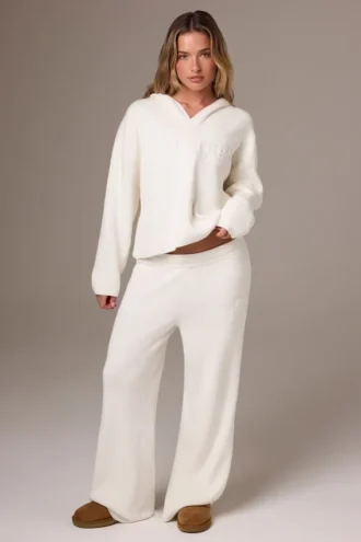 Pantaloni da jogging a gamba larga in maglia a costine color avorio