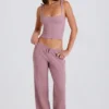 Pantaloni da jogging a gamba larga in maglia a costine color malva Pantaloni da jogging a gamba larga in maglia a costine color malva