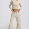 Pantaloni da jogging a vita bassa e gamba larga in color osso