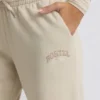 Pantaloni da jogging a vita bassa e gamba larga in color osso