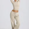 Pantaloni da jogging a vita bassa e gamba larga in color osso