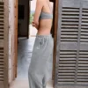 Pantaloni da jogging a vita bassa e gamba larga in cotone testurizzato con bottoni, colore grigio scuro Pantaloni da jogging a vita bassa e gamba larga in cotone testurizzato con bottoni, colore grigio scuro