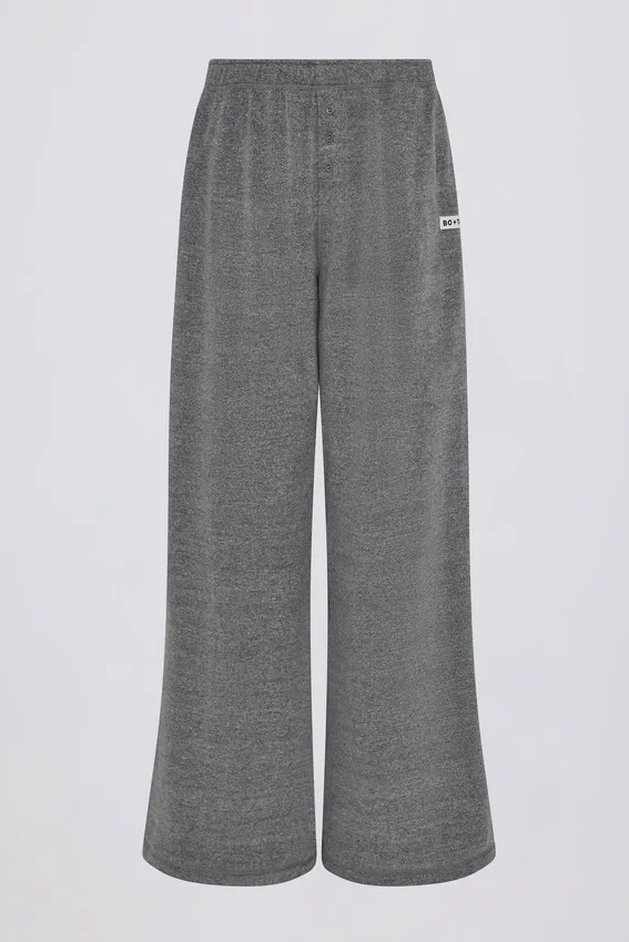 Pantaloni da jogging a vita bassa e gamba larga in cotone testurizzato con bottoni, colore grigio scuro Pantaloni da jogging a vita bassa e gamba larga in cotone testurizzato con bottoni, colore grigio scuro