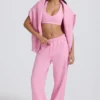 Pantaloni da jogging a vita media e gamba larga in morbido jersey di cotone, colore rosa confetto Pantaloni da jogging a vita media e gamba larga in morbido jersey di cotone, colore rosa confetto