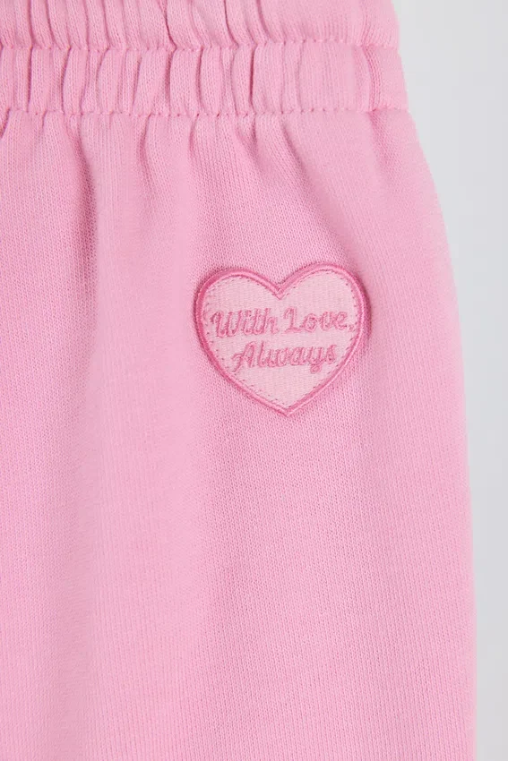 Pantaloni da jogging a vita media e gamba larga in morbido jersey di cotone, colore rosa confetto Pantaloni da jogging a vita media e gamba larga in morbido jersey di cotone, colore rosa confetto