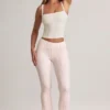 Pantaloni svasati a vita media con risvolto in modal Bebe con stampa a righe Pantaloni svasati a vita media con risvolto in modal Bebe con stampa a righe