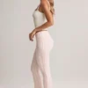 Pantaloni svasati a vita media con risvolto in modal Bebe con stampa a righe Pantaloni svasati a vita media con risvolto in modal Bebe con stampa a righe