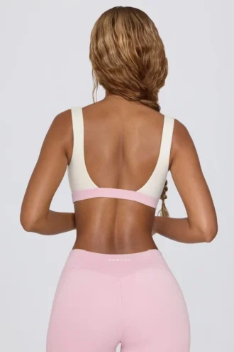 Reggiseno sportivo a contrasto in rosa pallido melange