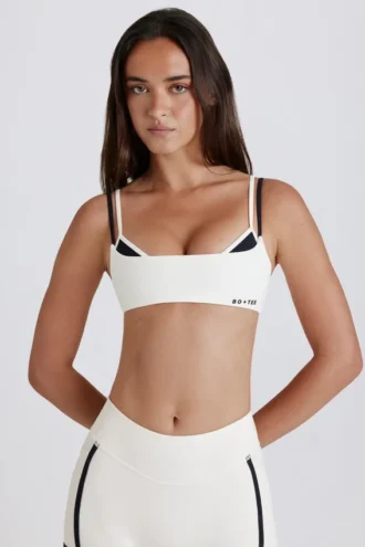Reggiseno sportivo a strati con intreccio sul retro in tessuto Soft Active color avorio