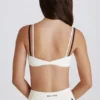 Reggiseno sportivo a strati con intreccio sul retro in tessuto Soft Active color avorio Reggiseno sportivo a strati con intreccio sul retro in tessuto Soft Active color avorio