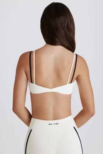 Reggiseno sportivo a strati con intreccio sul retro in tessuto Soft Active color avorio