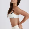 Reggiseno sportivo a strati con intreccio sul retro in tessuto Soft Active color avorio Reggiseno sportivo a strati con intreccio sul retro in tessuto Soft Active color avorio