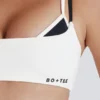 Reggiseno sportivo a strati con intreccio sul retro in tessuto Soft Active color avorio Reggiseno sportivo a strati con intreccio sul retro in tessuto Soft Active color avorio