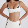 Reggiseno sportivo a strati con intreccio sul retro in tessuto Soft Active color avorio Reggiseno sportivo a strati con intreccio sul retro in tessuto Soft Active color avorio