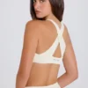 Reggiseno sportivo con scollo a V e spalline incrociate in crema Reggiseno sportivo con scollo a V e spalline incrociate in crema