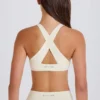 Reggiseno sportivo con scollo a V e spalline incrociate in crema Reggiseno sportivo con scollo a V e spalline incrociate in crema