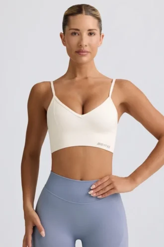 Reggiseno sportivo Define Luxe con scollo a V in bianco