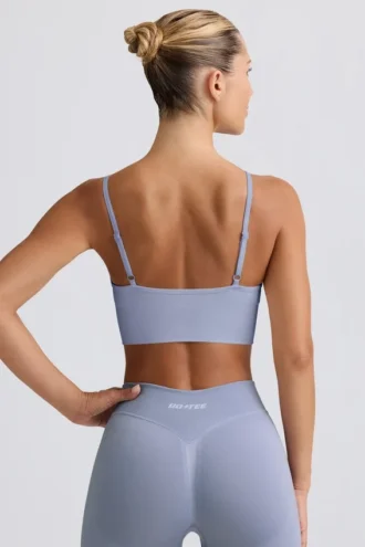 Reggiseno sportivo Define Luxe con scollo a V in grigio blu