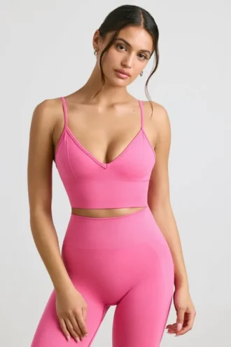 Reggiseno sportivo Define Luxe con scollo a V in rosa shocking