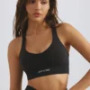 Reggiseno sportivo Define Luxe con scollo profondo in nero Reggiseno sportivo Define Luxe con scollo profondo in nero
