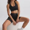 Reggiseno sportivo FlexiRib con dorso a vogatore in nero Reggiseno sportivo FlexiRib con dorso a vogatore in nero