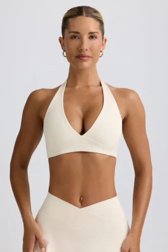 Reggiseno sportivo in jersey spazzolato con scollo a V in avorio melange