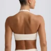 Reggiseno sportivo in jersey spazzolato con scollo a V in avorio melange Reggiseno sportivo in jersey spazzolato con scollo a V in avorio melange