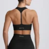 Reggiseno sportivo senza cuciture con dorso a T Super Sculpt in nero Reggiseno sportivo senza cuciture con dorso a T Super Sculpt in nero