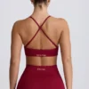 Reggiseno sportivo senza cuciture con incrocio sulla schiena Super Sculpt in bordeaux Reggiseno sportivo senza cuciture con incrocio sulla schiena Super Sculpt in bordeaux