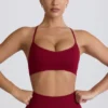 Reggiseno sportivo senza cuciture con incrocio sulla schiena Super Sculpt in bordeaux Reggiseno sportivo senza cuciture con incrocio sulla schiena Super Sculpt in bordeaux