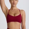 Reggiseno sportivo senza cuciture con incrocio sulla schiena Super Sculpt in bordeaux Reggiseno sportivo senza cuciture con incrocio sulla schiena Super Sculpt in bordeaux