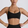Reggiseno sportivo senza cuciture con spalline incrociate Super Sculpt in nero Reggiseno sportivo senza cuciture con spalline incrociate Super Sculpt in nero