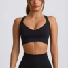 Reggiseno sportivo senza cuciture Super Sculpt con spalline incrociate in nero Reggiseno sportivo senza cuciture Super Sculpt con spalline incrociate in nero