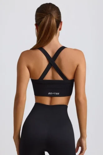 Reggiseno sportivo senza cuciture Super Sculpt con spalline incrociate in nero Reggiseno sportivo senza cuciture Super Sculpt con spalline incrociate in nero