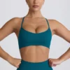 Reggiseno sportivo senza cuciture Super Sculpt con spalline incrociate sul retro in verde acqua Reggiseno sportivo senza cuciture Super Sculpt con spalline incrociate sul retro in verde acqua