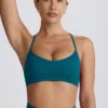 Reggiseno sportivo senza cuciture Super Sculpt con spalline incrociate sul retro in verde acqua Reggiseno sportivo senza cuciture Super Sculpt con spalline incrociate sul retro in verde acqua