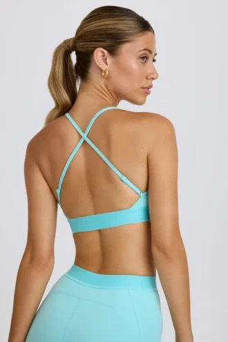 Reggiseno sportivo Soft Active con incrocio sulla schiena in acquamarina