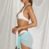 Sarong Elvire con lacci laterali in blu acqua Sarong Elvire con lacci laterali in blu acqua