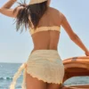 Sarong Molinas con lacci laterali a quadretti gialli Sarong Molinas con lacci laterali a quadretti gialli