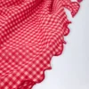 Sarong Molinas con lacci laterali a quadretti rossi Sarong Molinas con lacci laterali a quadretti rossi