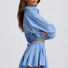 Shorts a pieghe in popeline di cotone a righe blu Shorts a pieghe in popeline di cotone a righe blu