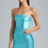 Simone Vestito corto senza spalline in denim metallizzato con cintura in color acquamarina Simone Vestito corto senza spalline in denim metallizzato con cintura in color acquamarina