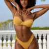 Slip Bikini a vita bassa in tessuto stropicciato color Marigold Slip Bikini a vita bassa in tessuto stropicciato color Marigold