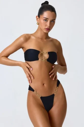 Top bikini a fascia con cut-out decorato Sunny Isles in nero