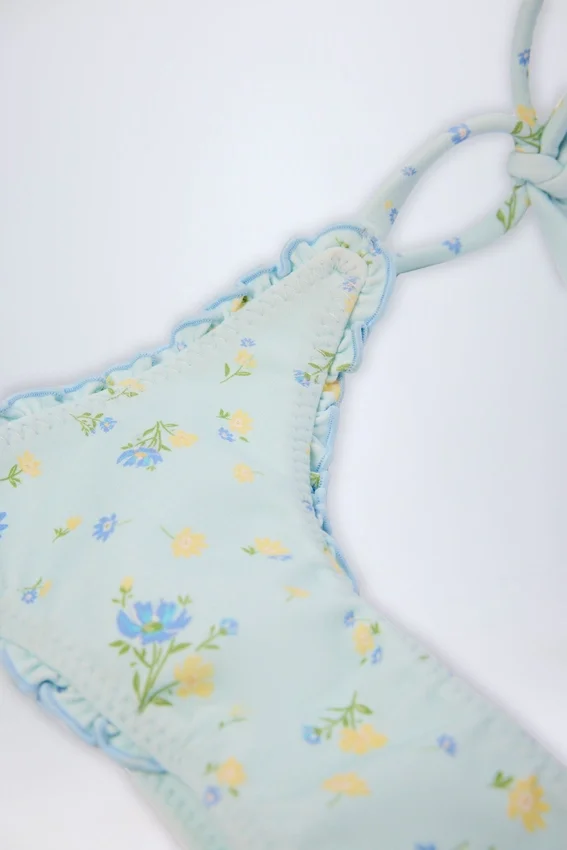Slip Bikini con lacci laterali Nieva in blu floreale Slip Bikini con lacci laterali Nieva in blu floreale