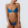Top bikini con scollo all’americana e ruches decorato Clearwater in blu oceano Top bikini con scollo all’americana e ruches decorato Clearwater in blu oceano